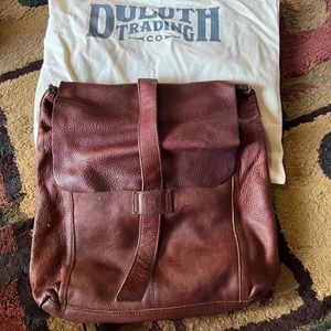 Convertible backpack with dust bag.